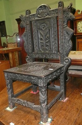 Lot 705 - A Victorian carved oak chair