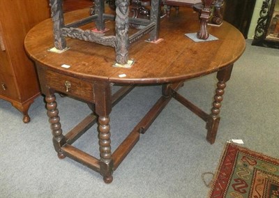 Lot 706 - An 18th century oak gateleg dining table