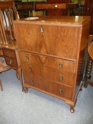 Lot 707 - An Art Deco Waring & Gillows walnut tallboy