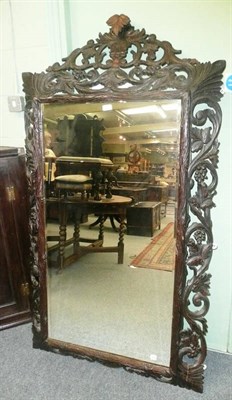 Lot 719 - Carved oak wall mirror