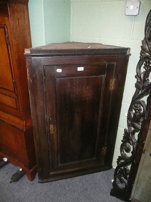 Lot 720 - A 19th century oak corner cupboard