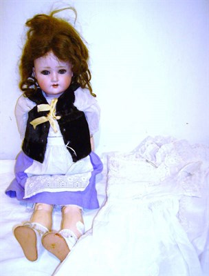 Lot 1005 - A Schoenau & Hoffmeister 1909 Bisque Socket Head Girl Doll with original wig, sleeping blue...