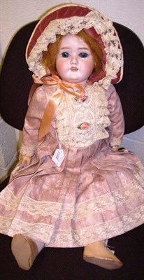 Lot 1007 - Schoneau & Hoffmeister Bisque Socket Head Doll impressed 1906 7.5, with original red wig, blue...