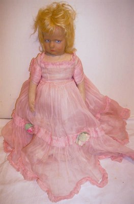 Lot 1014 - Circa 1930's Lenci Type Fabric Doll with painted and pressed face, side glancing blue eyes,...