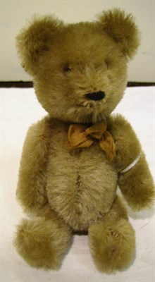 Lot 1024 - Schuco Yes/No Miniature Brown Jointed Teddy Bear, 14 cms and an extending plated cheroot holder (2)