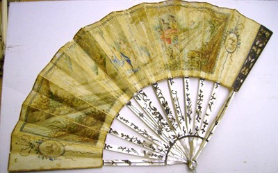 Lot 1099 - Late 18th Century Mother Of Pearl Fan with inlaid decoration to the sticks and guards, hand painted