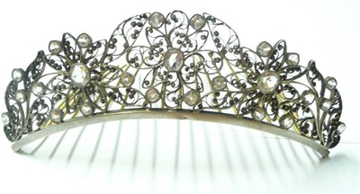 Lot 1144 - A Paste Diadem, oval and cushion cut white paste stones in a scroll work floral and leaf motif...