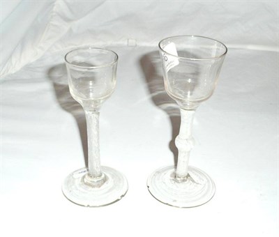 Lot 66 - An 18th Century Cordial glass with air twist stem, and another with baluster knopped cotton...