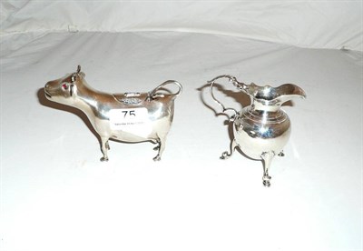 Lot 75 - Dutch silver creamer modelled as a cow and a silver jug (2)