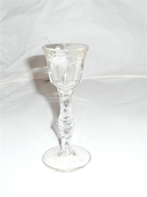 Lot 85 - An 18th Century Wine glass, the bell shape bowl cut and etched with trailing foliage, on a...