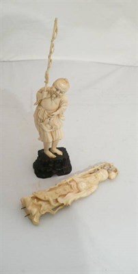 Lot 90 - Two ivory figures of a Deity and a fisherman