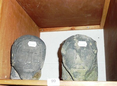 Lot 99 - Pair of 19th century stone heads *by repute from an outbuilding at Kettlewell