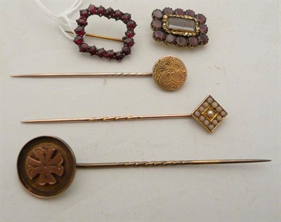 Lot 119 - A coral and split pearl pin, two other pins, a garnet memorial brooch (a.f.) and another