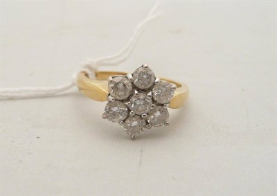 Lot 129 - 18 carat gold seven stone diamond cluster ring