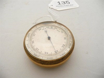 Lot 135 - A gilt pocket barometer combined with compass