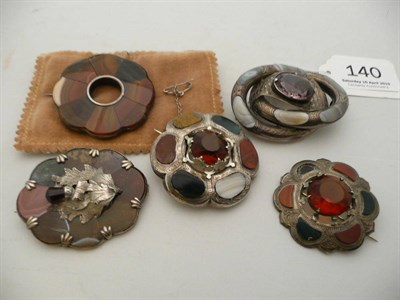 Lot 140 - Five Scottish hard stone brooches