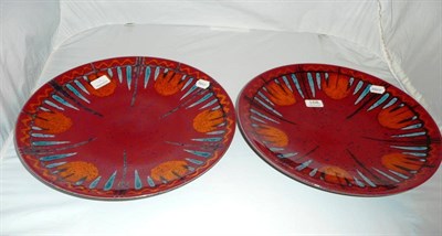 Lot 168 - A pair of Poole Exodus pattern chargers designed by Alan Clarke, 2000