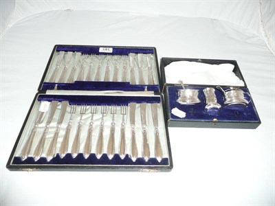 Lot 181 - Cased set of silver desert eaters and a cased silver cruet (2)