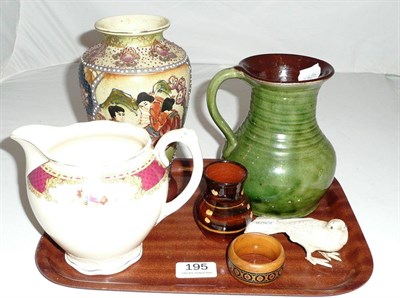 Lot 195 - Japanese carved bone figure of a bird, four pieces of pottery and a napkin ring