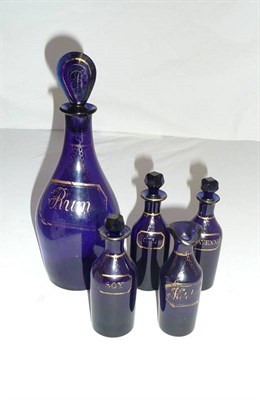 Lot 224 - A Bristol blue glass Rum decanter and four spice bottles.