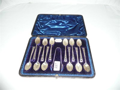 Lot 227 - A cased set of twelve silver spoons with sugar tongs, Sheffield hallmarks