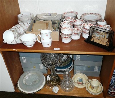 Lot 248 - Two shelves of decorative ceramics and glass including a cut glass mushroom lamp and shade,...