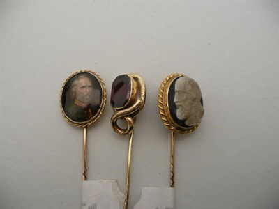 Lot 282 - Gold stick pin with a miniature portrait, another with cameo finial and another set with a...