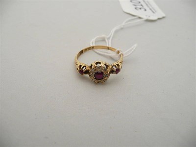 Lot 310 - An 18 carat gold, ruby and diamond cluster ring (one stone missing)