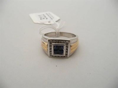 Lot 311 - A Gents sapphire and diamond two colour ring, stamped '14Kt', 12.5g approximately