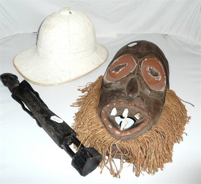 Lot 332 - Cameroon mask, another African carving and a pith helmet