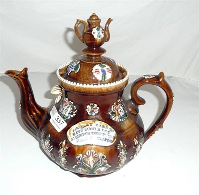 Lot 337 - A Measham teapot applied with panels inscribed "TIS VERY RARE TO HAVE SUCH A LOT, SO QUENCH...