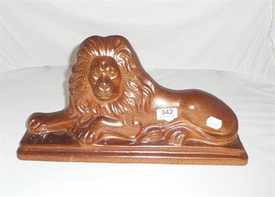 Lot 342 - A salt glazed stoneware lion hearth figure