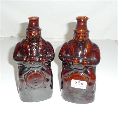 Lot 369 - Two treacle glaze gin flasks