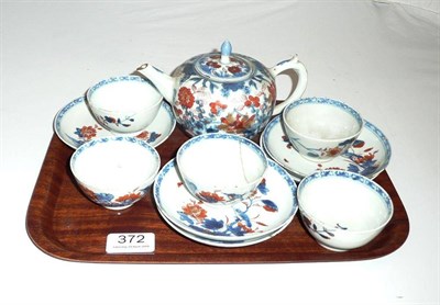 Lot 372 - 18th century clobbered teapot and five similarly decorated tea bowls (a.f.) and saucers