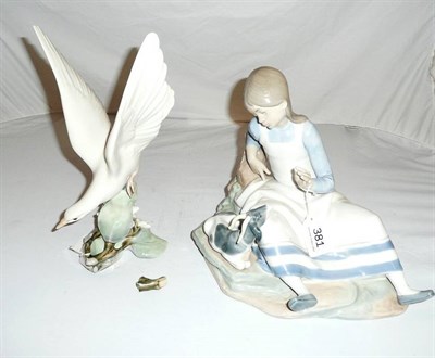 Lot 381 - A Nao china figure group - girl seated with goat together with a Lladro turtle dove (a.f.)