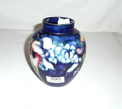 Lot 390 - Walter Moorcroft orchid and spring flowers ginger jar lacking cover (a.f.)