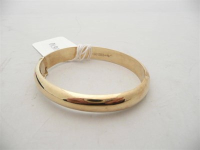 Lot 444 - A hinged bangle stamped '585', 'ART' 'C800', 22.7g approximately