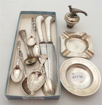 Lot 467 - Two silver ashtrays, silver caddy spoon, a silver pheasant bottle stopper, other silver flatwares