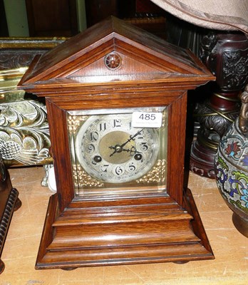 Lot 485 - A German oak mantel clock