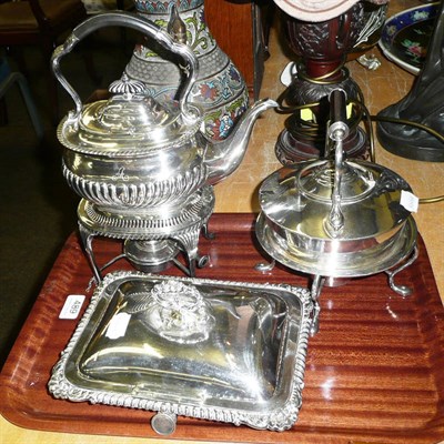 Lot 489 - Two silver-plated spirit kettles and a plated breakfast dish