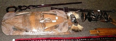 Lot 493 - Three tribal masks, a pace stick, sword, carved mahogany stick and tribal figure