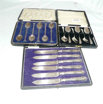 Lot 511 - Two cased sets of silver coffee spoons, cased set of tea knives (3)