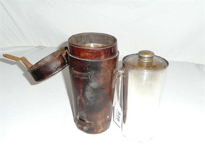 Lot 519 - Silver plated and leather flask in a stitched leather case