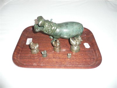 Lot 535 - Bronze hippo and five Eastern opium weights