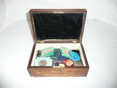 Lot 536 - A quantity of coins and £1 notes in a walnut casket including a gold half sovereign, 1912