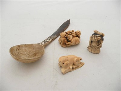 Lot 539 - Three carved netsukes and a bone spoon