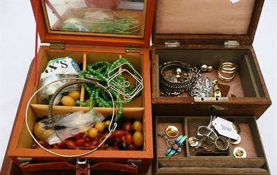 Lot 545 - Two jewellery boxes containing beads, silver rings, enamelled brooches etc and a strand of...