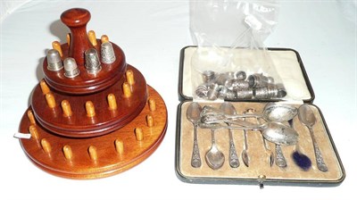 Lot 546 - Thirty-six silver and plate thimbles, six silver teaspoons, five spoons and tongs cased