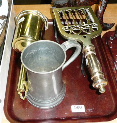 Lot 560 - A brass bottle jack, a brass clip-on trivet, a large pewter mug, two pewter measures and a key