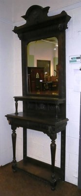 Lot 629 - A dark stained oak mirror back hall table